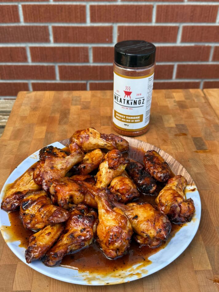 cooked chicken wings with honey bbq rub bottle 