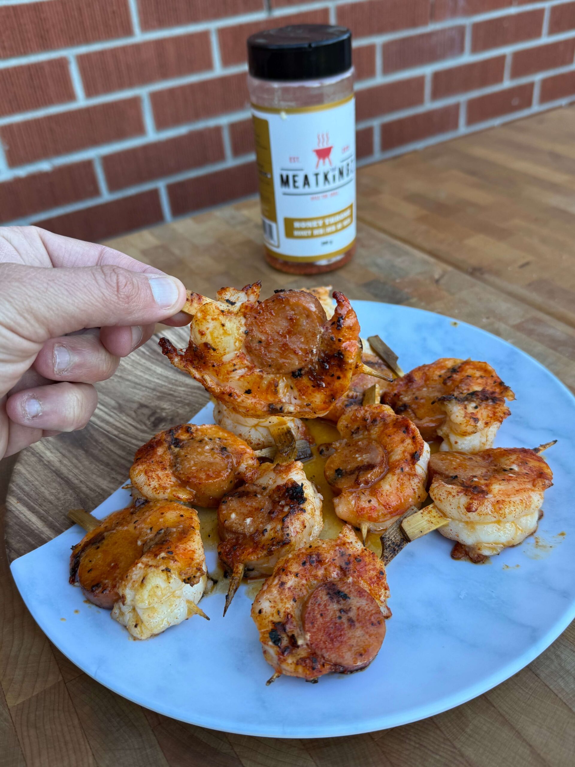 shrimp and sausage with honey throne behind