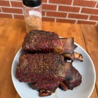 beef ribs with Texas reign behind it